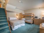 Bedroom with queen size bed and set of bunks